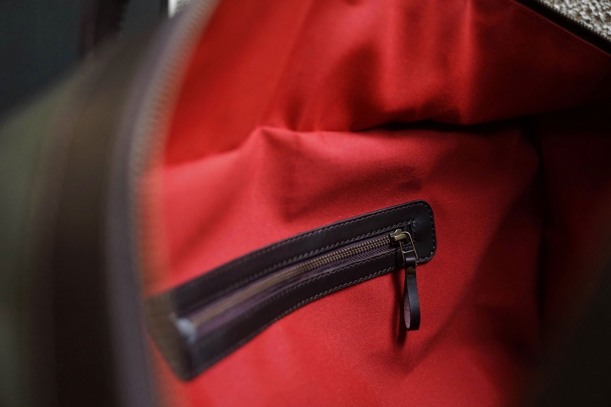 One zippered pocket inside. This shot is from the C.O. Travel/Olive