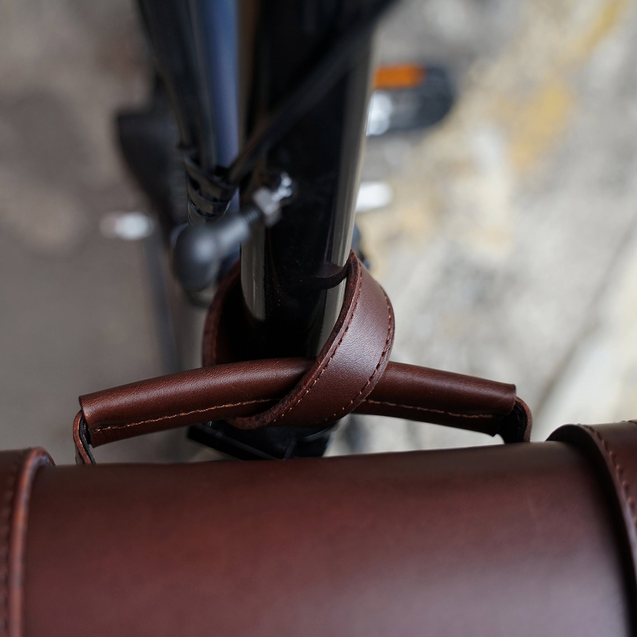 A strap is used to tie the bag/s handle or body strap to your bike.